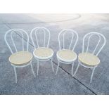 Four metal framed dining chairs,