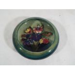 A Moorcroft Pottery inverted bowl decorated in the Spring Flowers pattern, 11.