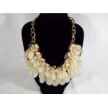 A lady's unusual, good quality fashion necklace, with beaded floral detail,