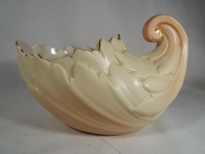 A Royal Worcester large blush ivory shell vase, gilded rim, 10.