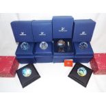 Four Swarovski crystal paperweights predominantly boxed