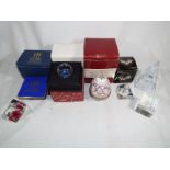 A collection of predominantly paperweights to include a Manchester 2002 Cagerswall,  Swarovski,