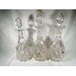 A pair of good quality matching heavy cut glass decanters and a further heavy cut glass decanter,