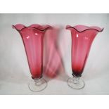 A matched pair of Cranberry Glass trumpet vases,