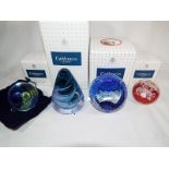 Four Caithness paperweights to include a mini Moon flower, red, Millennium 2000 cobalt blue,