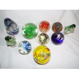 A collection of good quality paperweights to include Caithness, Saffron,