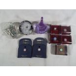 Three glass paperweights to include Caithness ring stand,