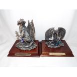 Two Myth and Magic pewter figurines on wooden plinths entitled The Crystal Dragon and The Keeper of