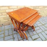 A nest of three modern mahogany tables the largest measuring approximately 58cm (h) x 47cm (w) x