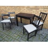 A compact modern dining set comprising flip-top table, two dining chairs and two folding chairs,