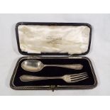 A George V silver hallmarked spoon and fork set, boxed  Birmingham assay 1914.