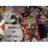 Two boxes containing a large quantity of unsorted comics, magazines,