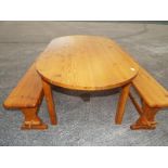 A pine kitchen table with two matching pine benches 73 cm (h) x 86 cm (w) x 150 cm (l)