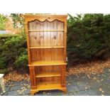 A modern pine display cabinet,