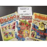A large collection of unsorted comics, children's annuals,