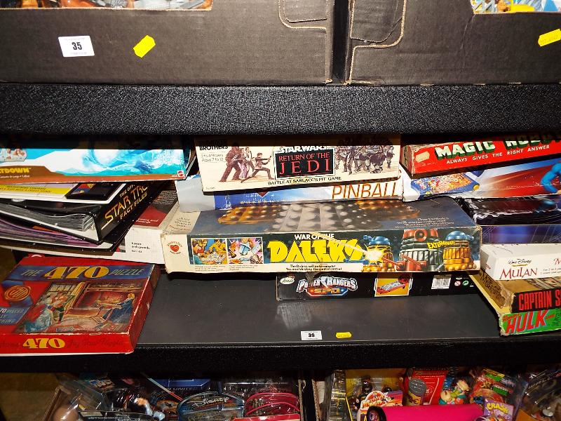 A full shelf containing a large quantity of board games