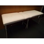A good quality white faux leather portable massage table with adjustable back support and protective