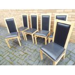 Six wooden and black faux leather dining chairs (6)