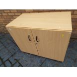 A modern light wood cabinet with twin doors 72cm (h) x 90cm (w) 50cm (d)