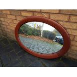 A good quality mahogany oval wall mirror 61cm x 87cm
