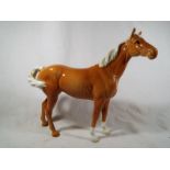 A Beswick Palomino Swish Tail Horse 1st