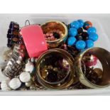 A box of unsorted costume jewellery