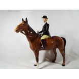 A Beswick Huntswoman, (Rider and Horse S