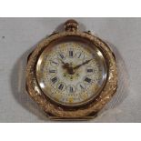 A 14 carat gold pocket watch with cerami