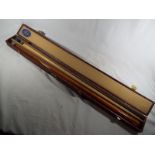 A two piece Snooker Cue in hard case