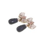 A Fancy Pair of Diamond Yellow and Blue Sapphire Clip Earrings. Set in yellow 18 carat gold.