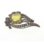 A Lemon Topaz and Silver mounted Brooch. Set with Rose cut Diamonds. Set in silver and 9 carat