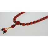 A 19th century Coral, Turquoise, Jet and Gold Bead Necklace. 180mm long. The pendant with 70mm drop.