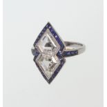 A Platinum Set Diamond and Sapphire Ring. Each Diamond 10mm long. 10mm wide. 2mm deep. Colour