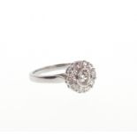 A Diamond Cluster Ring. Set in high carat white metal. Stamped 585. tests as 14carat gold. The