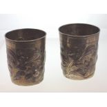 A Pair of 17th Century Parcel Gilt German Silver Beakers. Nuremburg. circa 1660. Each embossed in