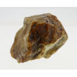 A Large Piece of Natural Uncut Amber. Pale yellow in colour., 70mm high. 120mm long. 231.9 grams.