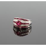 A Platinum Set Diamond and Ruby Ring. Size N. 8.6 grams.