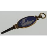 A Yellow Gold and Steel Watch Key. Inset with Wedgwood Blue Japer. 53mm long.