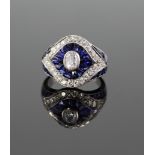 A Platinum Set Diamond and Sapphire Dress Ring. Size K/L 7.4 grams.  Very good condition. Diamond