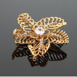A French Diamond Set Leaf Brooch Clip. Set in 18 carat yellow gold. Of wirework flower design. The