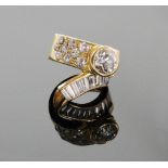 A Diamond Set Cross Over Ring. Set with