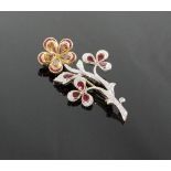 An Ornate Diamond Ruby and Cognac Coloured Diamond Set  Flower Brooch. Set in high carat yellow