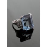 An Art Deco Aquamarine and Diamond Set Dress Ring. The central stone approximately 9.76 carats. Size