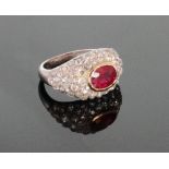 A Diamond and Ruby Cluster Ring. Set in