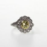 A  Natural Yellow and White Diamond Dress Ring. Set in high carat white metal. Tests as Platinum.