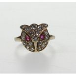 A Diamond and Ruby Dress Ring. In the fo