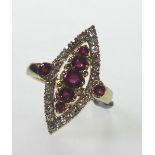 A Ruby and Diamond Dress Ring. Set in hi