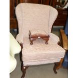 Wing fireside chair on cabriole legs and