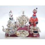 Silver plated spirit kettle on stand, teapot, cruet set, card tray, two glass clown decanters,