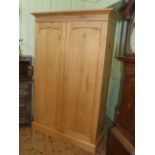Waxed pine two door fitted wardrobe